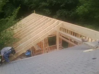 Framing a new roof addition that ties into an existing shingle roof in Flatonia
